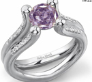 A gorgeous William Goldberg Ashoka ring is encrusted with diamonds