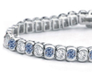 Platinum or gold flexible flat bracelets, set entirely with matched or graduated marquise, pear, square, oblong or round brilliants with small diamons intervenin; also cabochon emeralds, sapphires or rubies with small diamonds intervening.... each 500. to 15,000.