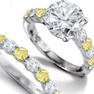 Rose-cut diamonds accent the yellow and oxidized white gold floral Buccellati band