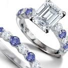 A sapphire design classic from R. Eiserian features a cushion-cut and diamond side stones