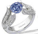 A delicate
nineteenth-century ring from R. Eiserian has a sapphire at the center of a diamond square