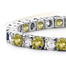A diamond
ribbon wraps around a round brilliant on an ultra-feminine dior ring
