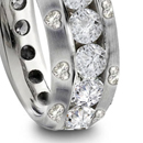 with two round or pear-shaped diamonds at sides in simple, plain, grooved, fluted, or wxquisitely carved mountings