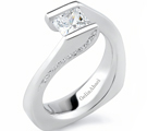 The sweet Gumdrop ring with a round brilliant by Chris Correia has a curvy band with diamond
sprinkles