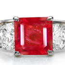Shop for Ruby Rings - A stunning ring showcases an emerald-cut and tapered baguettes.