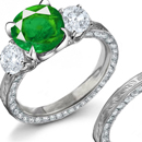 the ring bears either an emerald or a sapphire