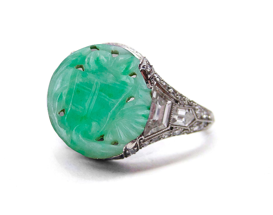 Edwardian, Belle Epoque, French Platinum, Natural Color Deep Candy Apple Green Carved Jadeite Burma Jade Cabochon Ring Flanked with Baguette Diamonds