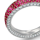 A round brilliant sits in a collet on top of a stylish diamond split-shank ring by H. Stern