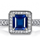 A stunning Winston ring showcases an emerald-cut and tapered baguettes