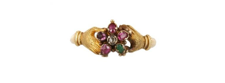16th century amuletic jewelry the ivory hand wearing gold rings set with an emerald and a garnet mounted in filigree enamelled gold to form a pendant spanish mano cornuta was directed against the evil eye